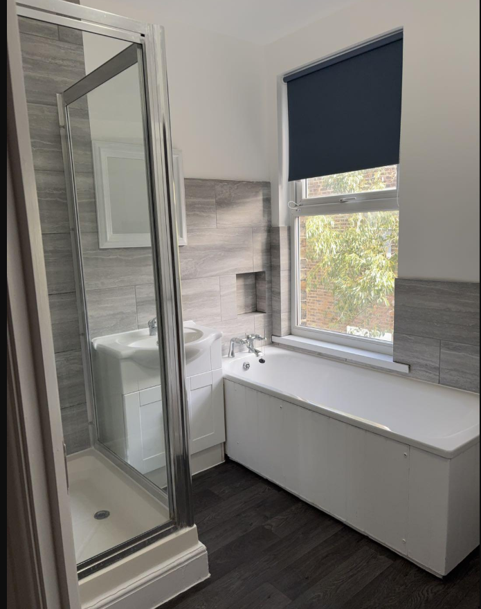 Bathroom with bath and shower