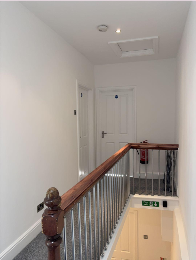 Shared landing and stair rails